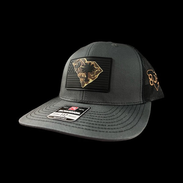 803 Richardson Charcoal Black Duck Camo Performance PVC Patch Trucker Hat