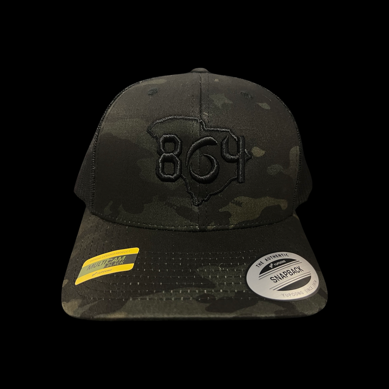 864 Yupoong Black Camo Trucker