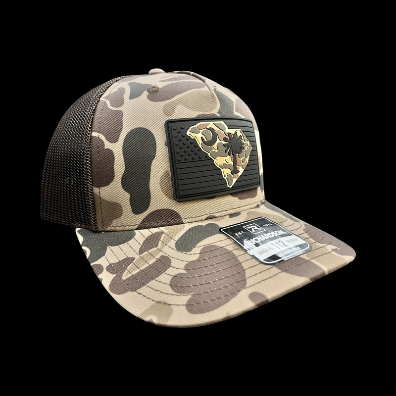 803 Richardson Performance Bark Brown Duck Camo Black PVC Patch Trucker Hat