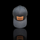 803 Yupoong Black/Black Leather Patch Trucker