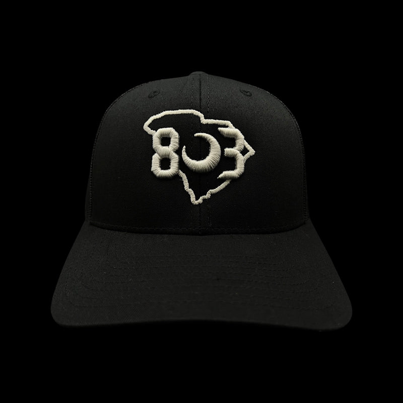 803 Yupoong Black Trucker - silver logo