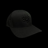 803 Yupoong Black Trucker - silver logo